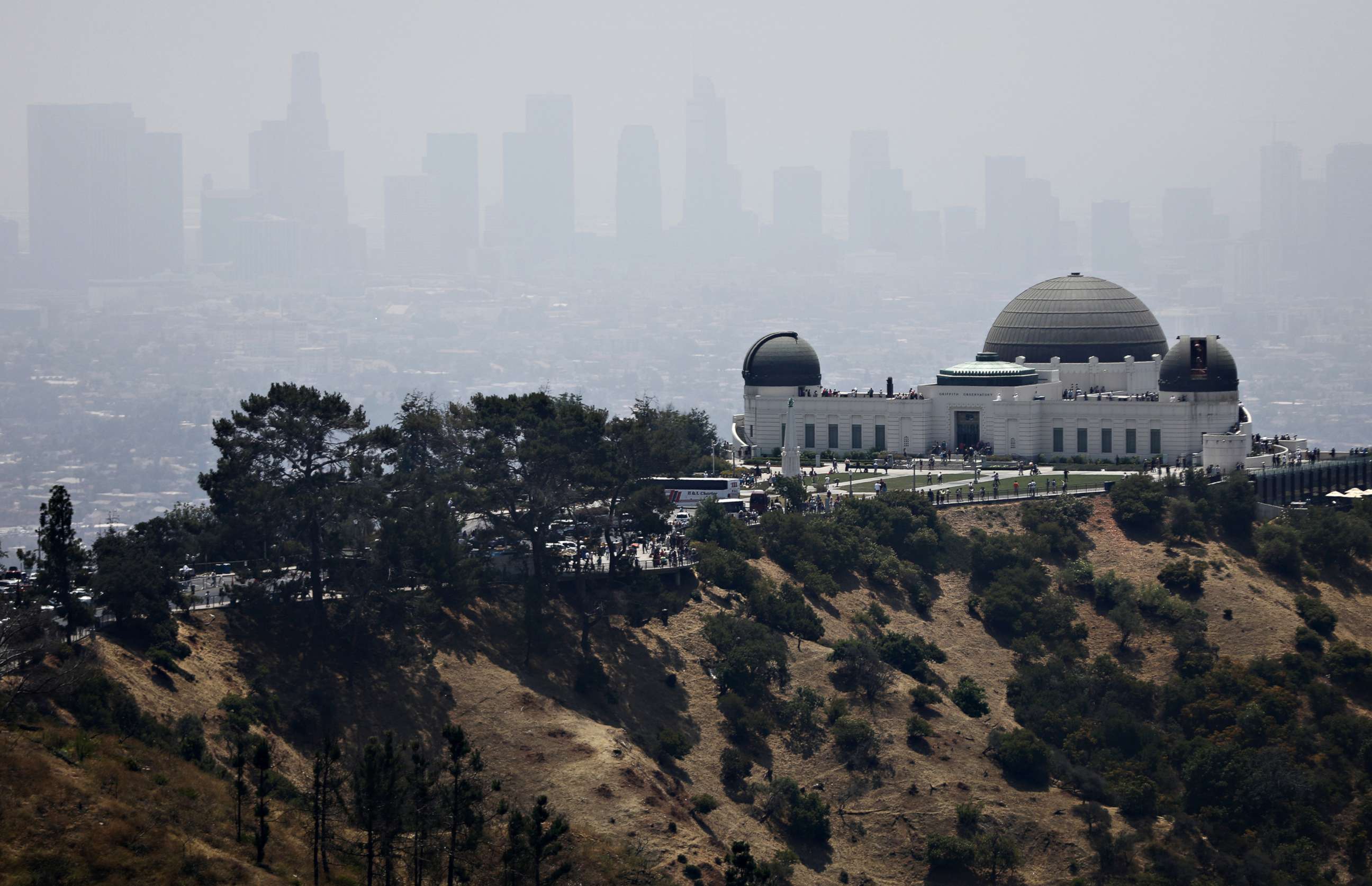 PHOTO: The Griffith Observatory stands with downtown Los Angeles in the background, on July 5, 2019, in Los Angeles.