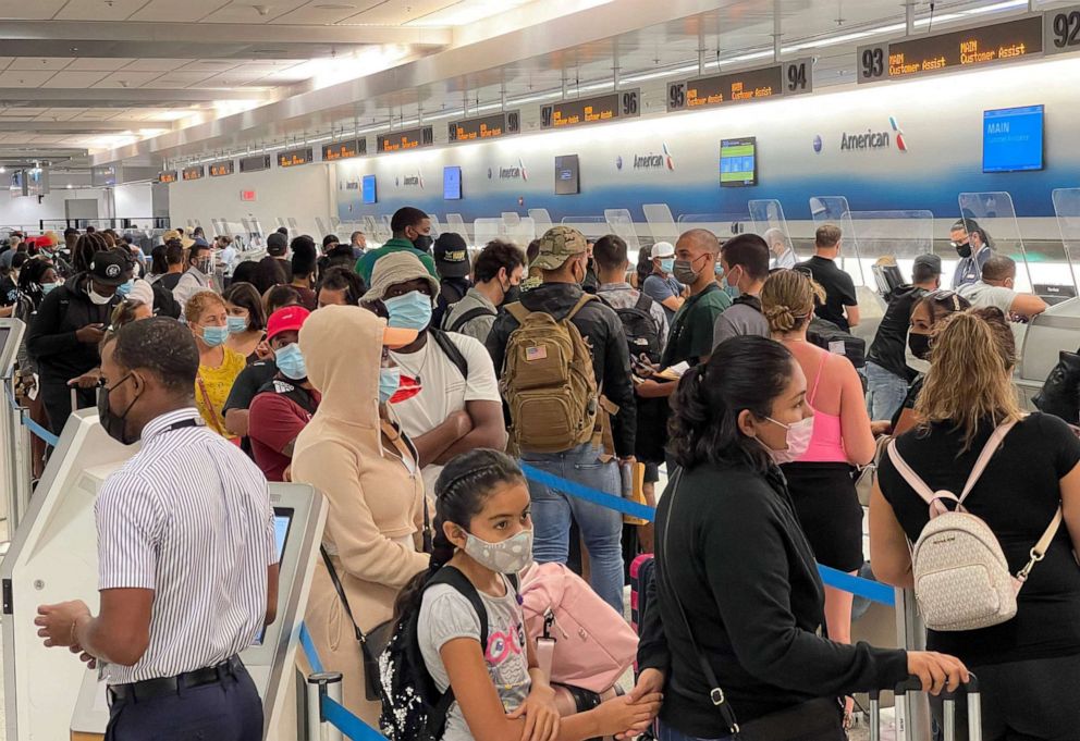 PHOTO: In this file photo travelers line up at Miami International Airport (MIA) on Aug. 2, 2021.