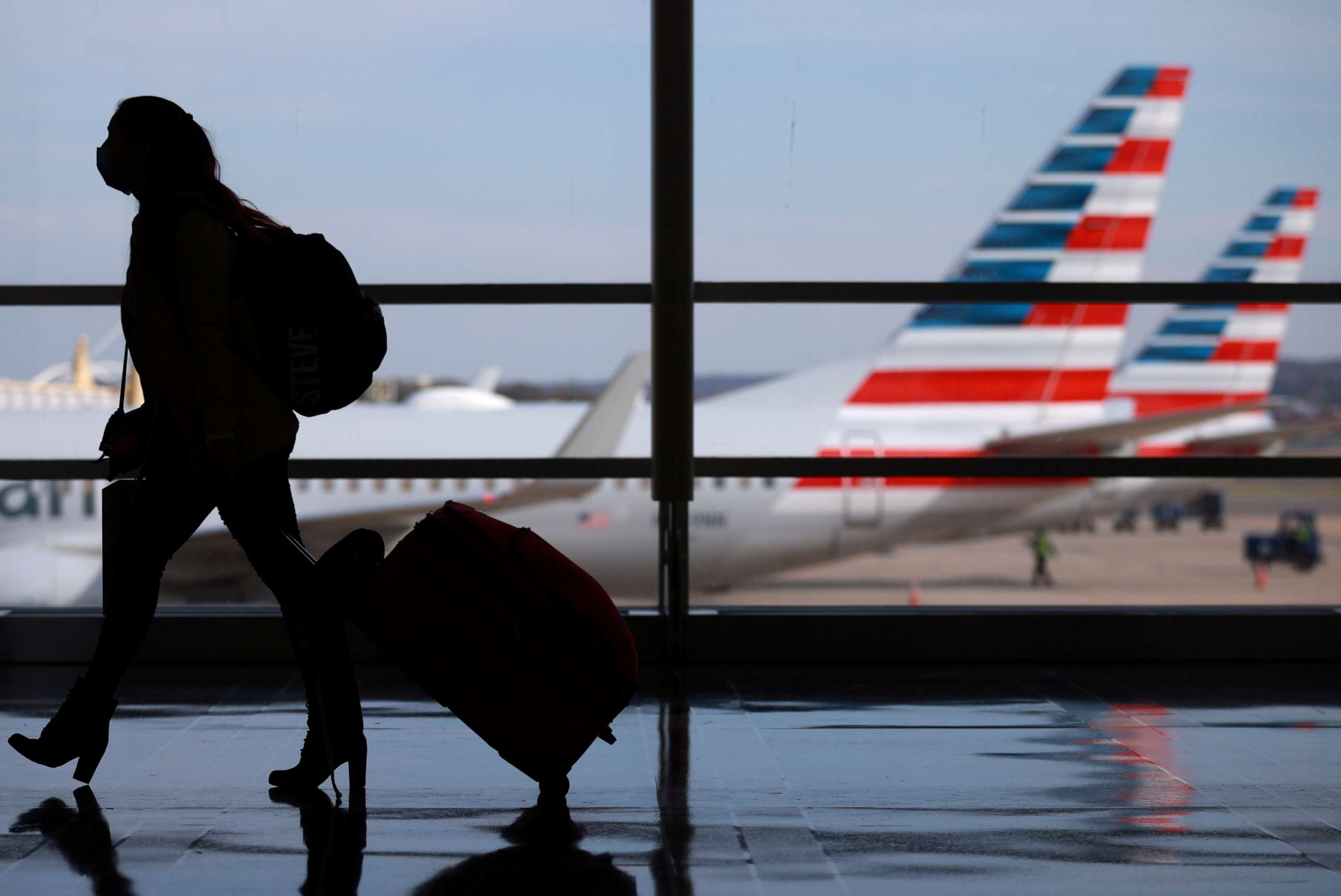 PHOTO: A person walks at Reagan National Airport ahead of the Thanksgiving holiday in Arlington, Va., Nov. 25, 2020.