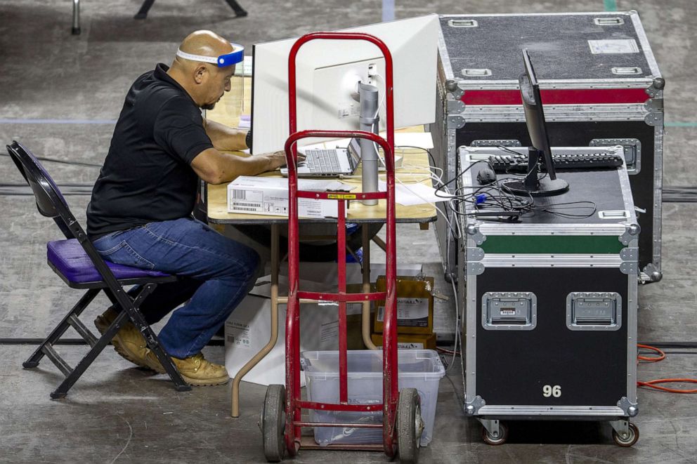 PHOTO: Maricopa County ballots from the 2020 general election are examined and recounted by contractors hired by the Arizona Senate at the Veterans Memorial Coliseum in Phoenix, May 7, 2021.