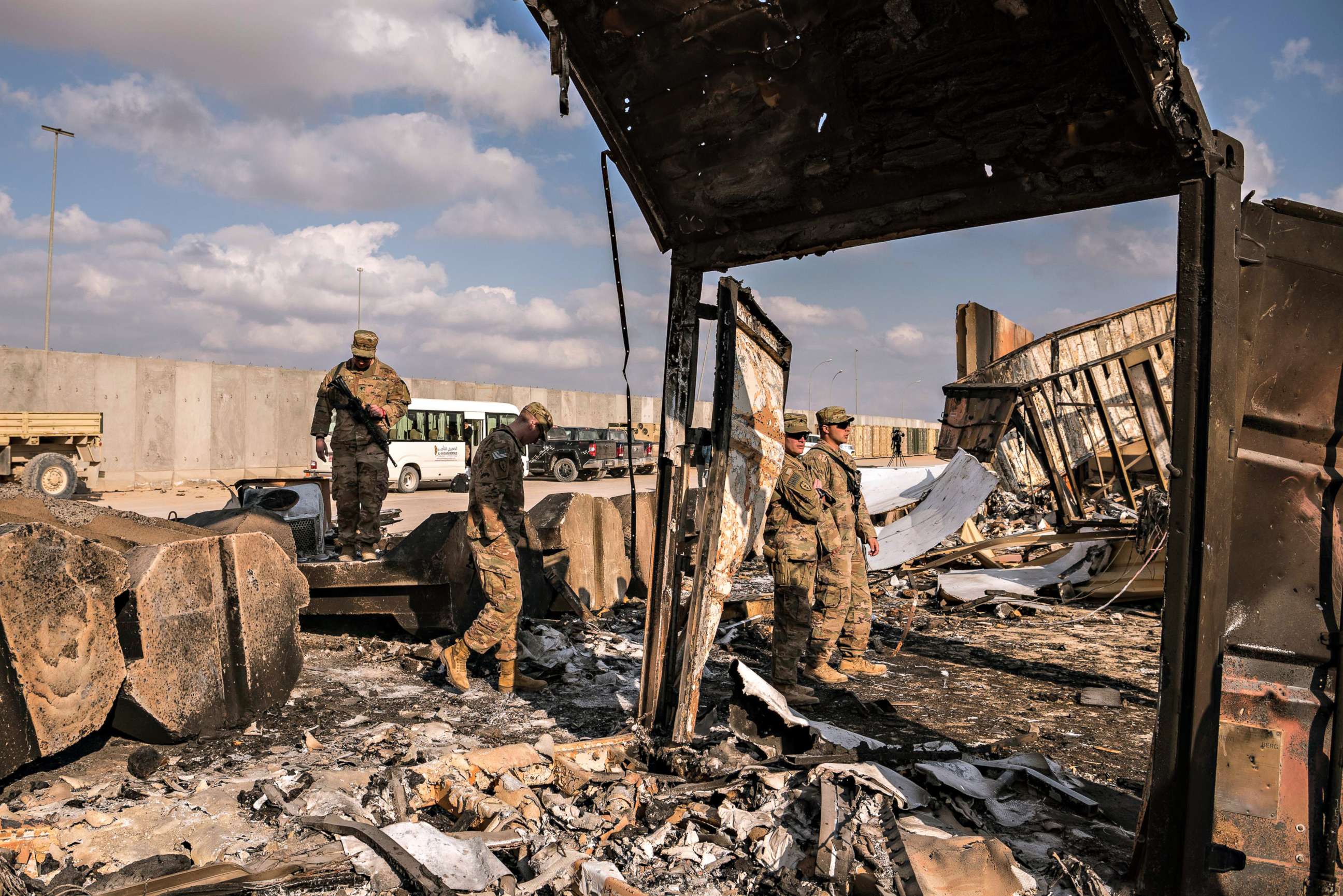 PHOTO: FILE - U.S. military personnel look at damage to a building at Al Asad Air Base in Anbar Province, west of Baghdad on Jan. 13, 2020 after the Jan. 8 Iranian airstrikes on the base.
