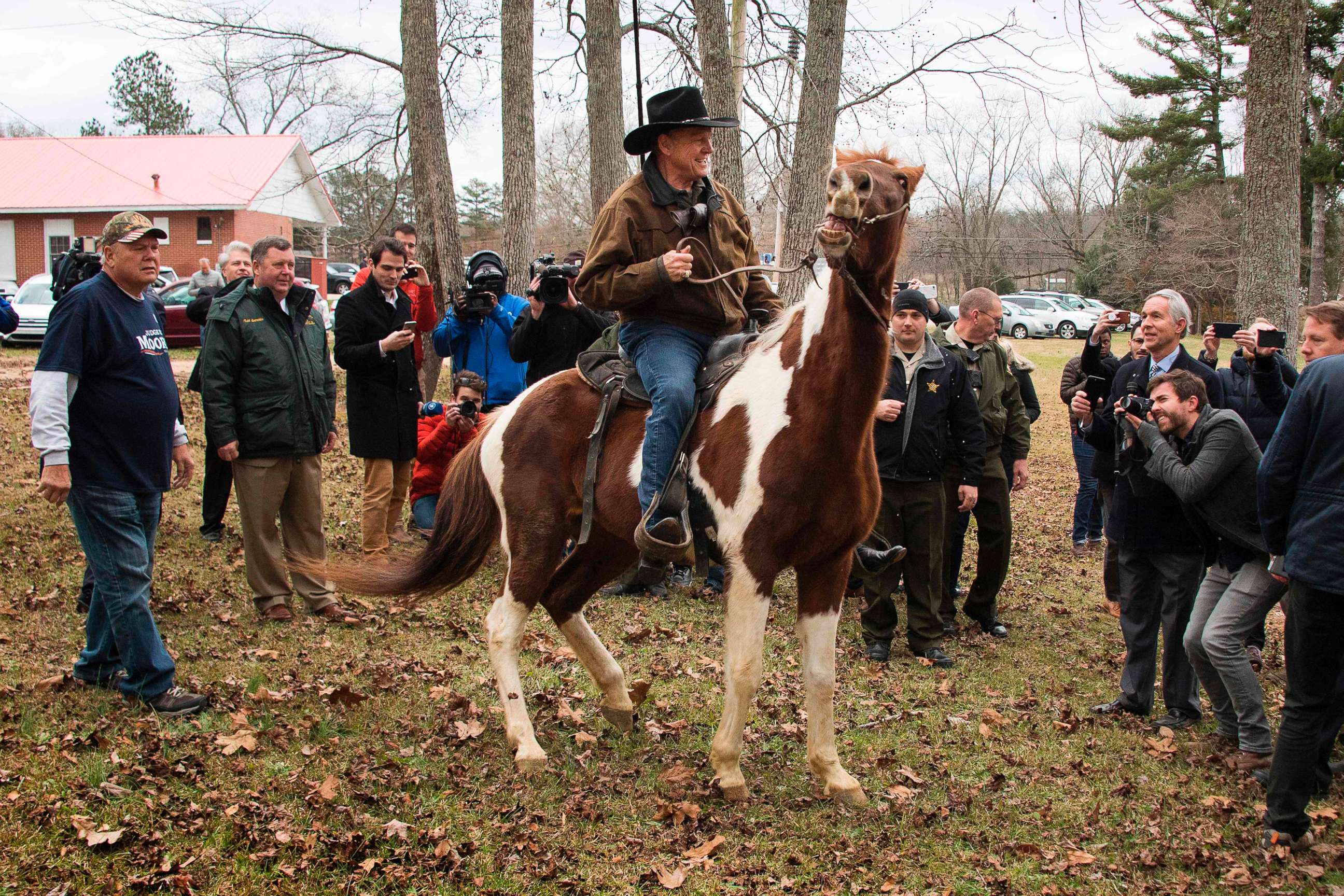 PHOTO: Republican senatorial candidate Roy Moore departs on his horse at the polling station after voting in Gallant, Ala., Dec. 12, 2017.