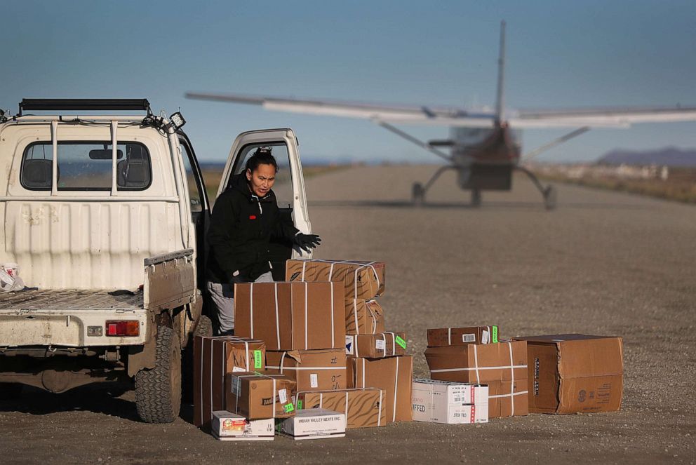 PHOTO: Supplies are dropped off by a plane on the dirt runway, Sept. 14, 2019 in the remote village of Kivalina, Alaska. Supplies needed for the town are brought in either by barge or plane since there are no roads leading connecting it to other towns.