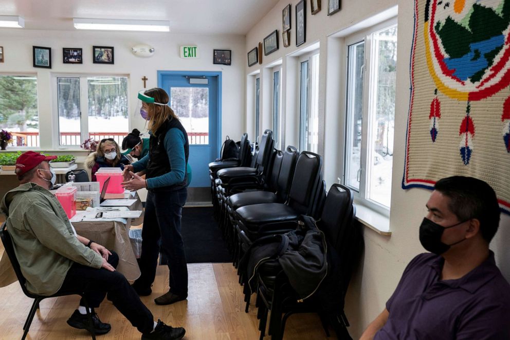 PHOTO: Nurse Practitioner Kim Sonderland speaks with tribal villagers before beginning their (COVID-19) vaccines in Eagle, Alaska, March 31, 2021.