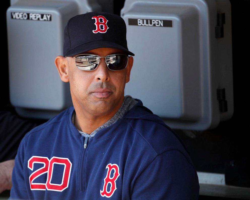 Manager Alex Cora of the Boston Red Sox looks on from the dugout