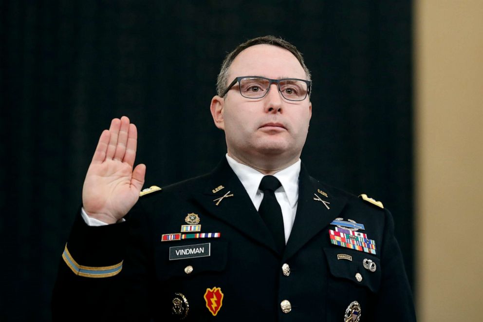PHOTO: National Security Council aide Lt. Col. Alexander Vindman is sworn in to testify before the House Intelligence Committee on Capitol Hill in Washington during a public impeachment hearing of President Donald Trump.