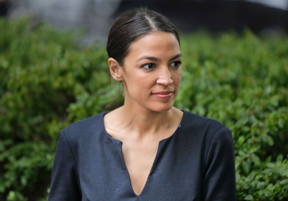   PHOTO: Alexandria Ocasio-Cortez takes a moment between interviews in New York, June 27, 2018. 