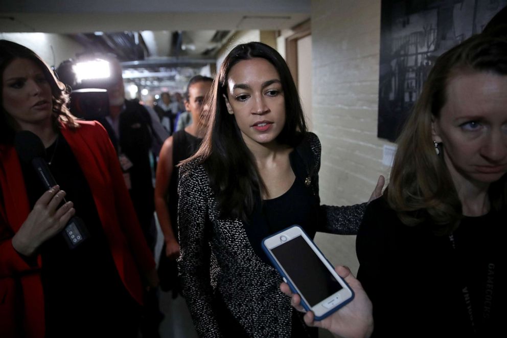 PHOTO: Rep. Alexandria Ocasio-Cortez answers questions from reporters as she leaves a House Democratic caucus meeting on the potential impeachment of U.S. President Donald Trump on May 22, 2019, in Washington.