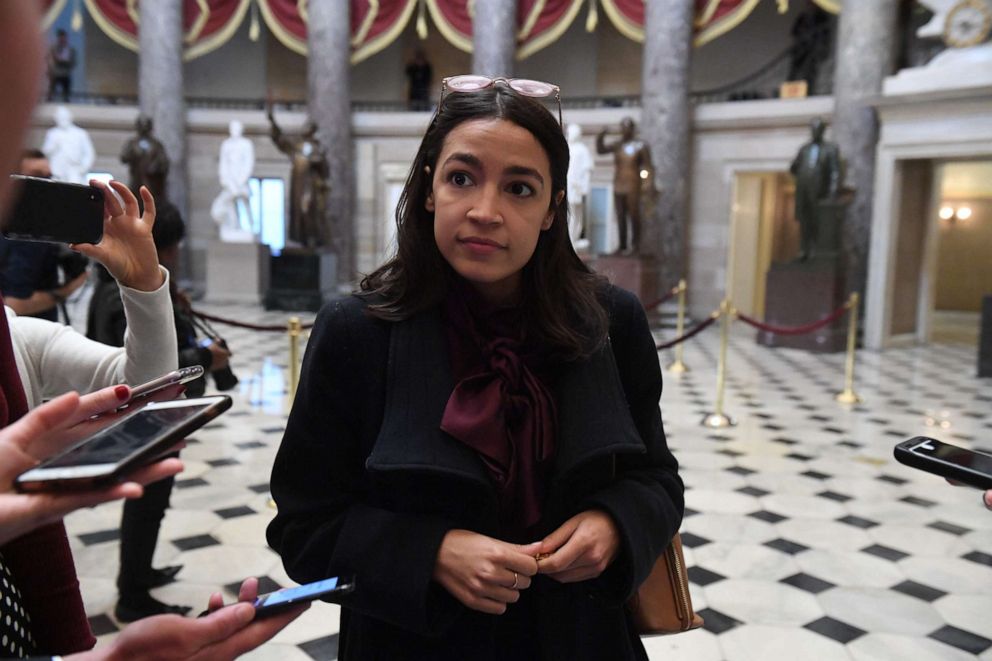 PHOTO:Rep. Alexandria Ocasio-Cortez talks with reporters at the Capitol, Dec. 18, 2019, in Washington, DC.