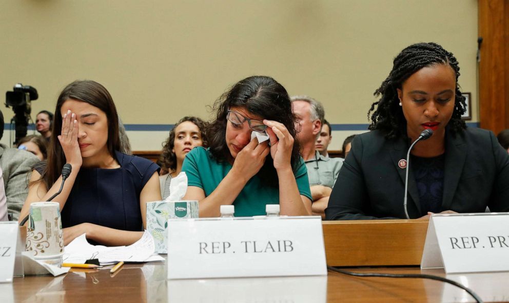 PHOTO: Rep. Rashida Tlaib, center, alongside Alexandria Ocasio-Cortez, left, wipes her eyes after testifying before the House Oversight Committee hearing on family separation and detention centers, July 12, 2019, on Capitol Hill in Washington.