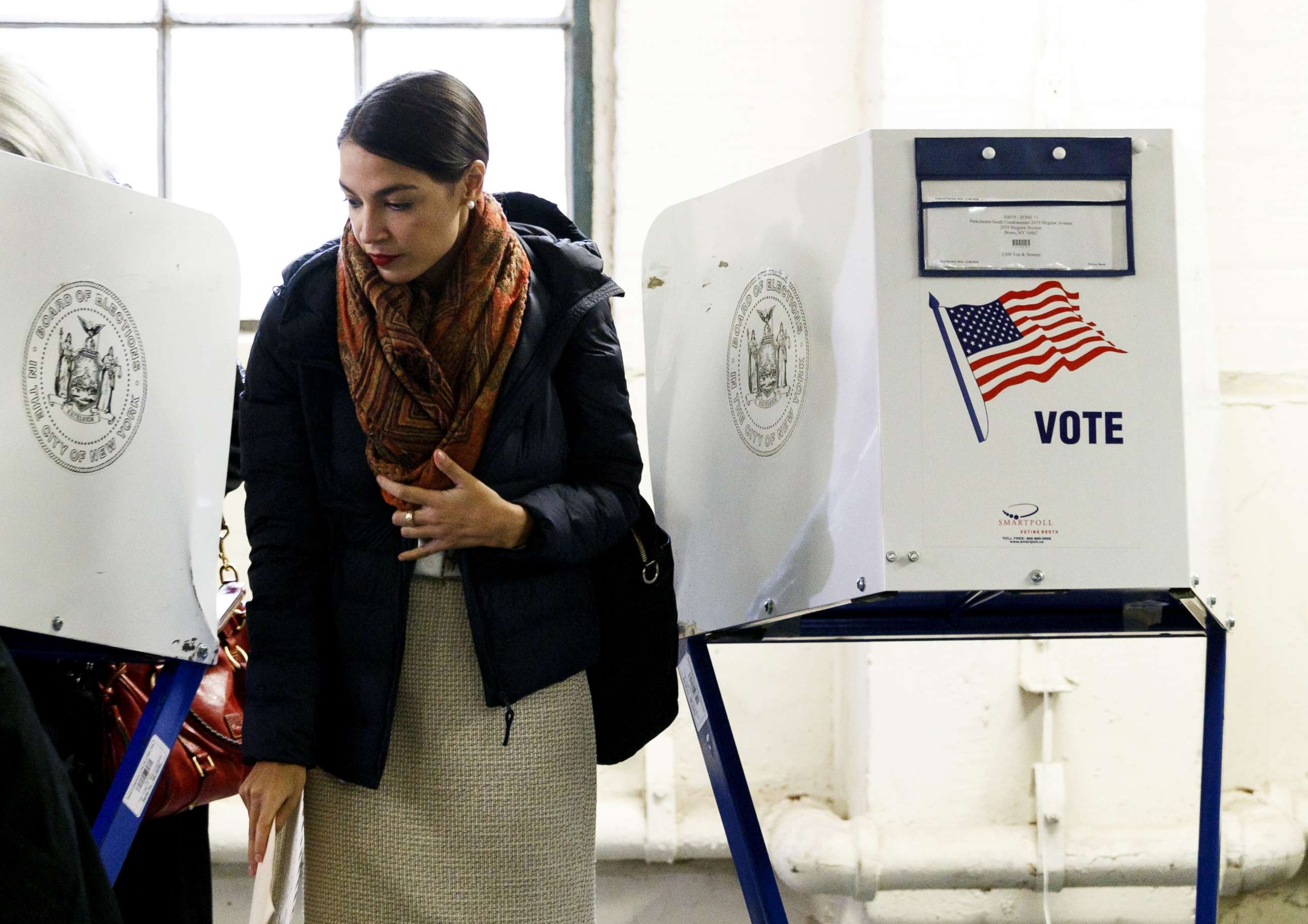 PHOTO: Alexandria Ocasio-Cortez casts her vote in the 2018 mid-term general election at a polling site in the Bronx, New York, Nov. 6, 2018.