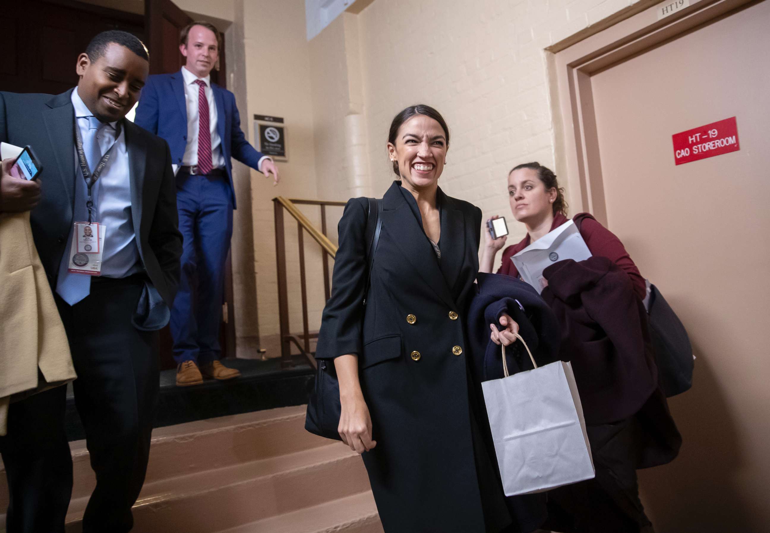PHOTO: Rep.-elect Alexandria Ocasio-Cortez, D-N.Y., joined at left by Rep.-elect Joe Neguse, D-Colo., exit a Democratic Caucus meeting in the basement of the Capitol in Washington, Nov. 15, 2018.