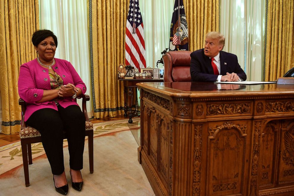 PHOTO: President Donald Trump speaks with Alice Johnson, criminal justice reform advocate and former federal prisoner, in the Oval Office of the White House in Washington, Aug. 28, 2020.
