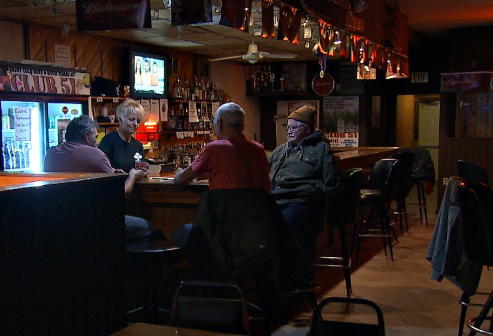 PHOTO: Inside Club 51, the only bar in downtown Postville, Ia., a group of local men play cards and discuss immigration. Im for the wall 100%, said one resident, who asked to remain anonymous, speaking with ABC News.