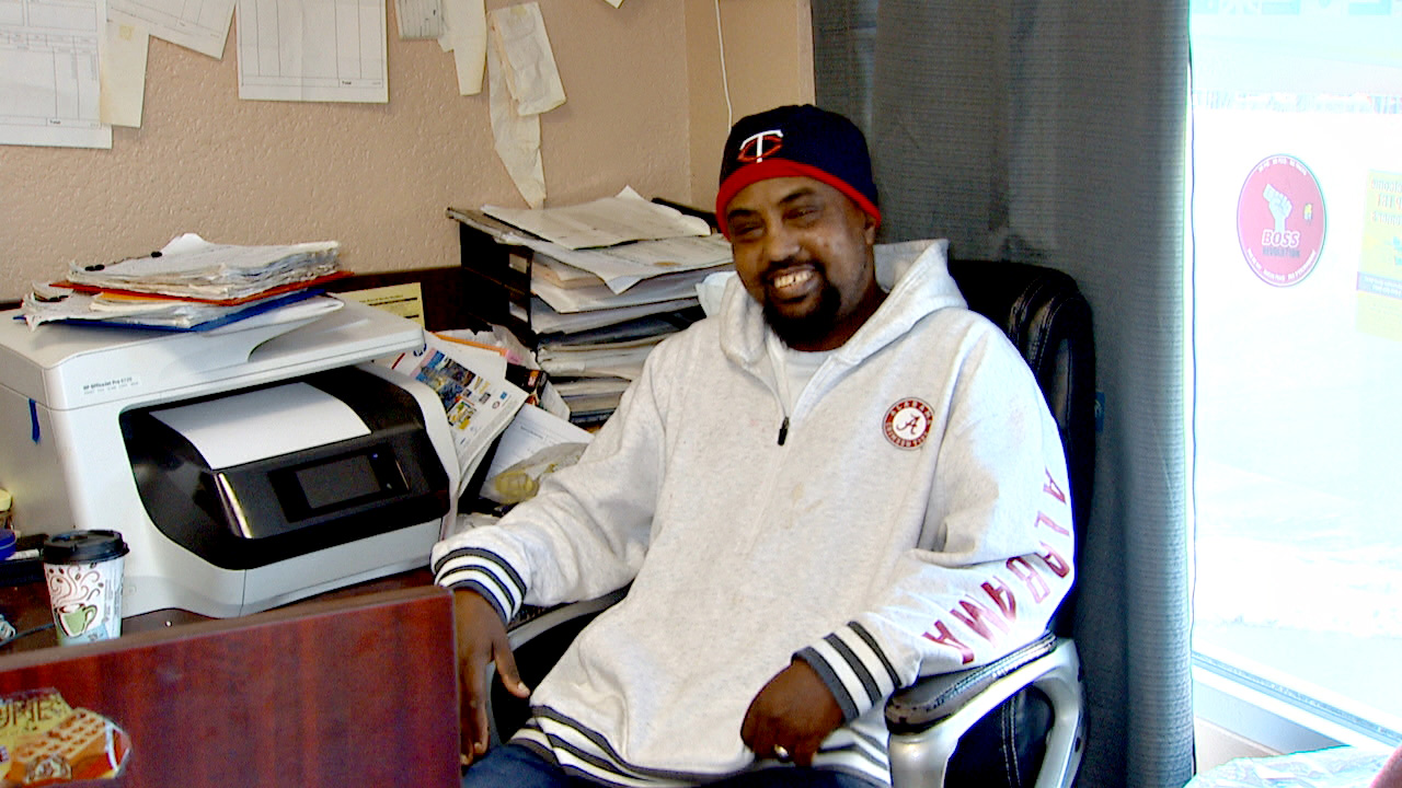 PHOTO: Local business owner Said Ibrahim sells Muslim headscarves and other staples for traditional Somali cooking at his shop in Postville, Ia.  He also works in the town?s meatpacking plant.