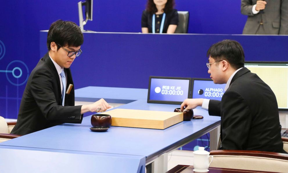 PHOTO: The Worlds top human player Ke Jie (L) competes against Googles artificial intelligence program AlphaGo during the Future of Go Summit at Wuzhen Town on May 23, 2017, in Jiaxing, Zhejiang Province of China.