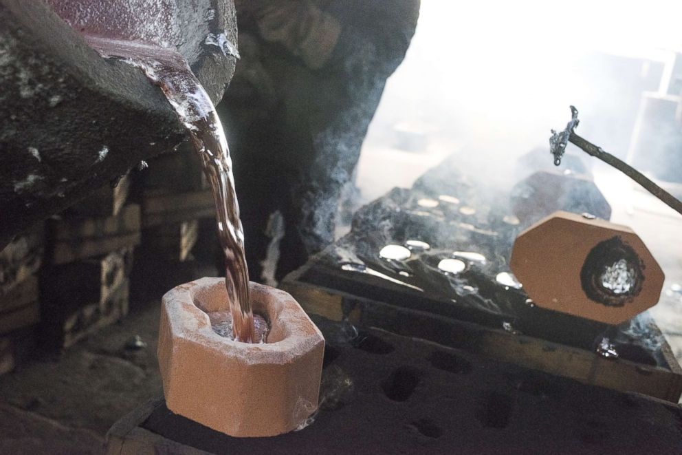 PHOTO: Molten aluminum is poured out of a crucible and into a mold at the Lite Metals Co., a magnesium and aluminum foundry in Ravenna, Ohio, Sept. 20, 2017.