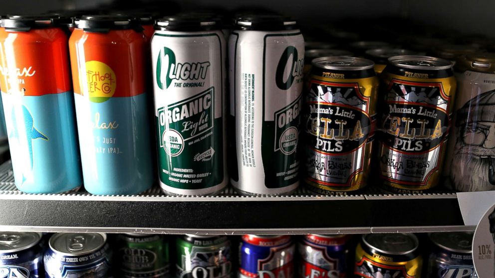 Beer in aluminum cans is displayed on a shelf at Ales Unlimited on March 2, 2018, in San Francisco. Beverage companies that use aluminum for canned drinks are concerned that tariffs proposed by US President Donald Trump could result in higher prices for consumers and job cuts across the industry. 