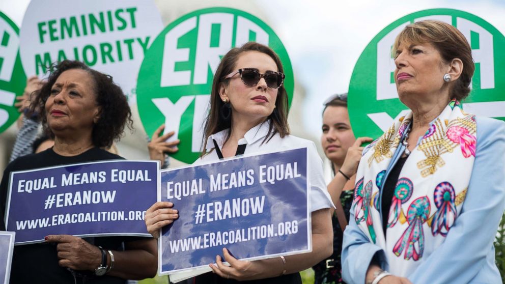 From left, Carol Jenkins, of the Equal Rights Amendment Task Force, actress Alyssa Milano, and Rep. Jackie Speier, D-Calif., attend a news conference at the House Triangle on the need to ratify the Equal Rights Amendment, June 6, 2018, in Washington.