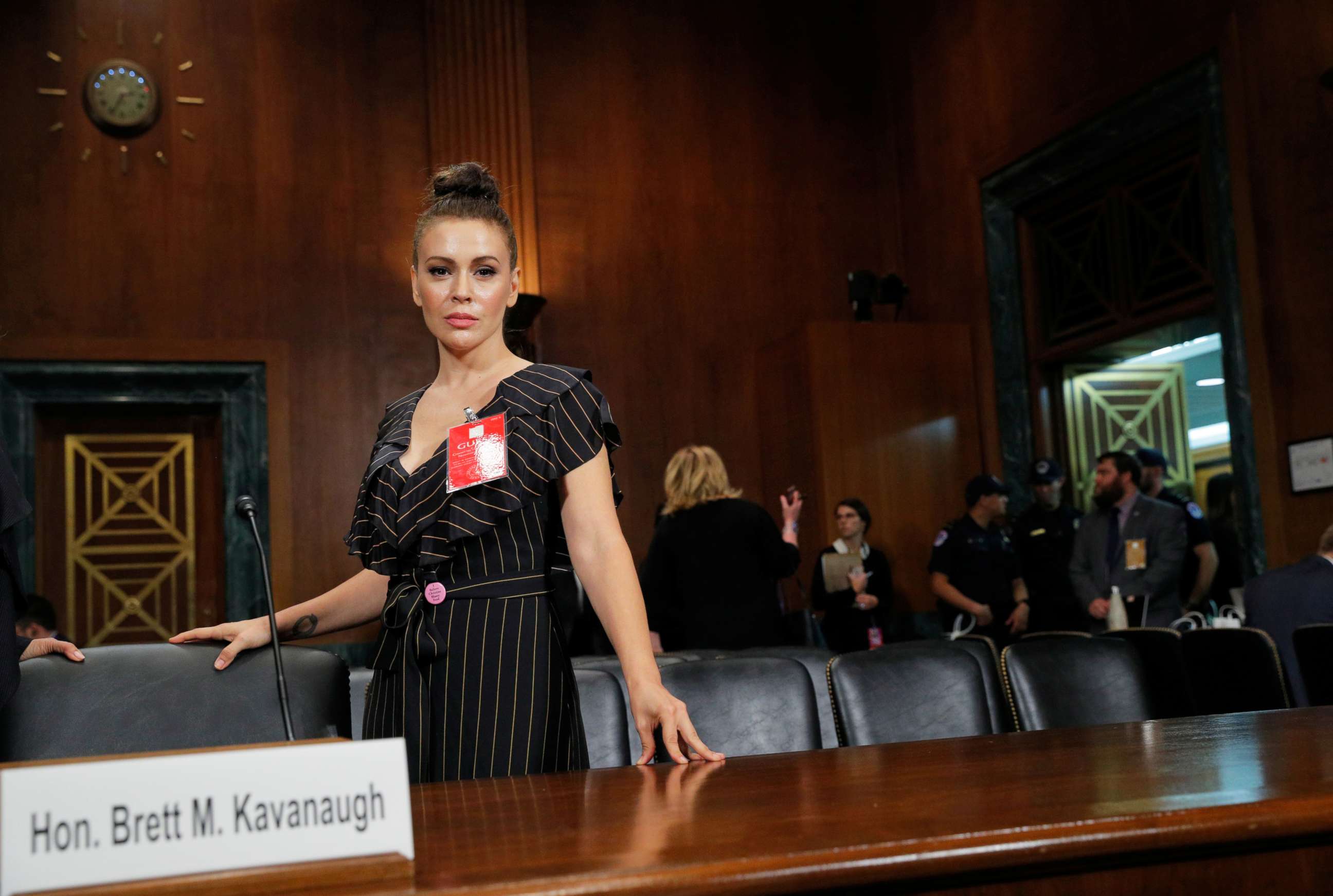 PHOTO: Actor Alyssa Milano stands in the hearing room after the conclusion of testimony before a Senate Judiciary Committee confirmation hearing on Capitol Hill in Washington, Sept. 27, 2018.