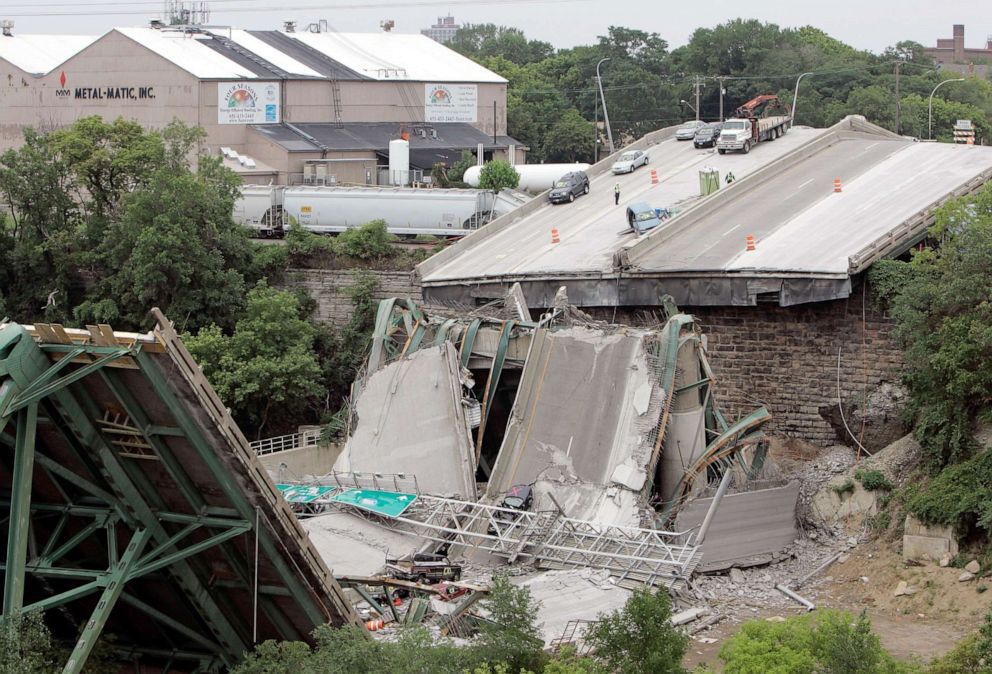 PHOTO: Vehicles are strewn amongst the wreckage of Interstate 35W bridge, Aug. 5, 2007.
