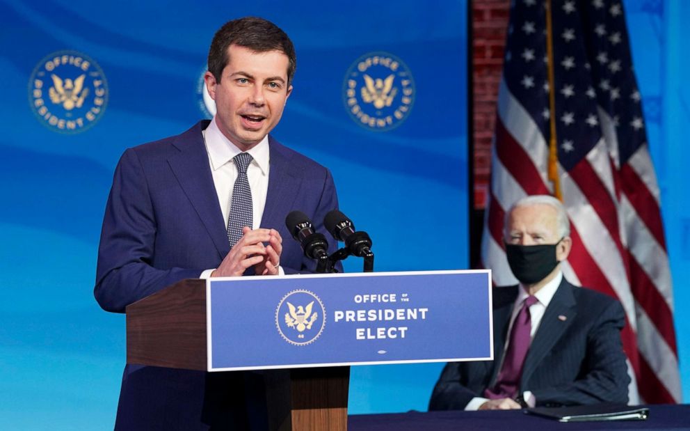 PHOTO: Former South Bend, Ind. Mayor Pete Buttigieg, President-elect Joe Biden's nominee to be transportation secretary reacts to his nomination as Biden looks on during a news conference at The Queen theater in Wilmington, Del., Dec. 16, 2020. 