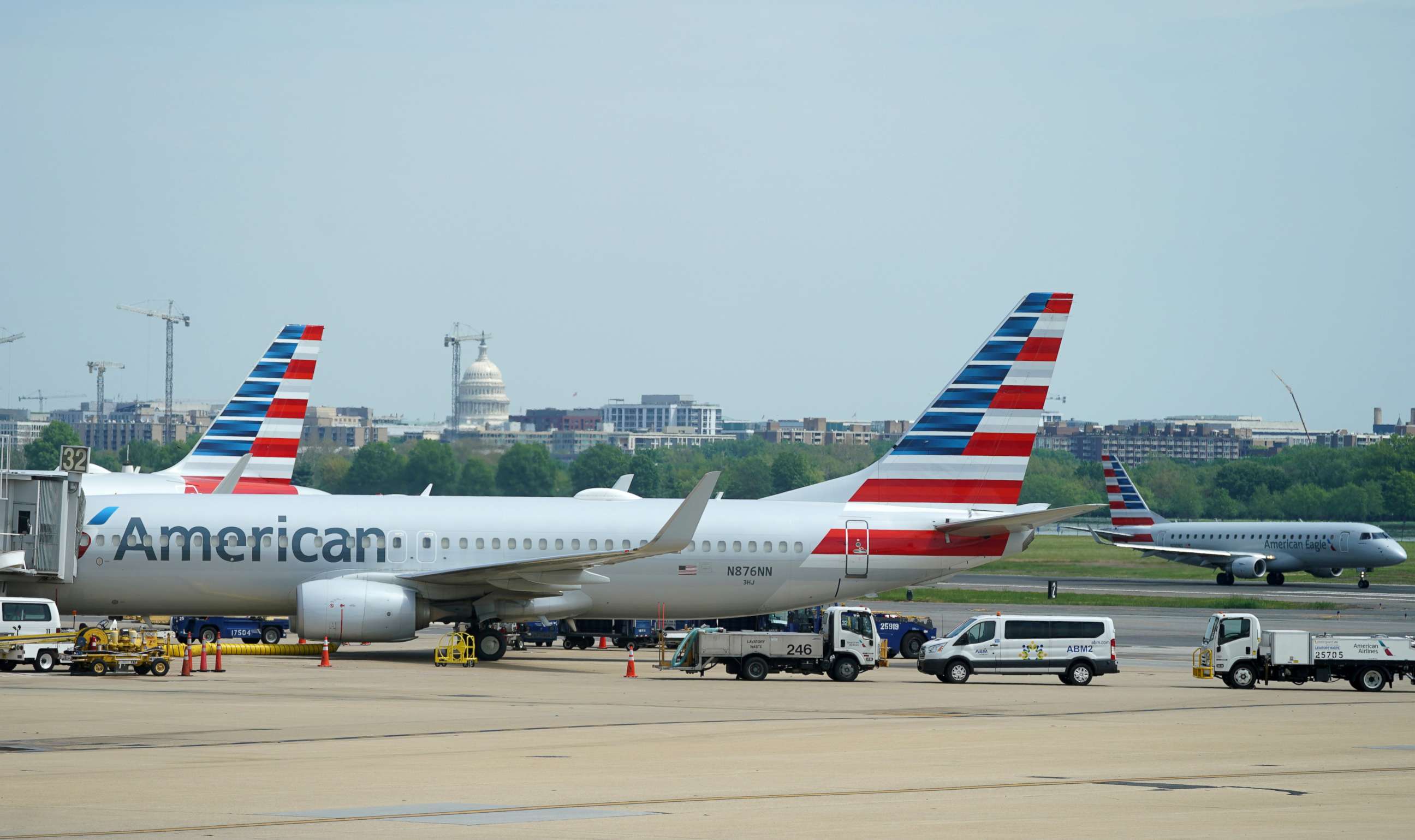PHOTO: An American Airlines Boeing 737 jet sits at a gate at Washington's Reagan National airport with the U.S. Capitol building in the background, in Washington, April 29, 2020.
