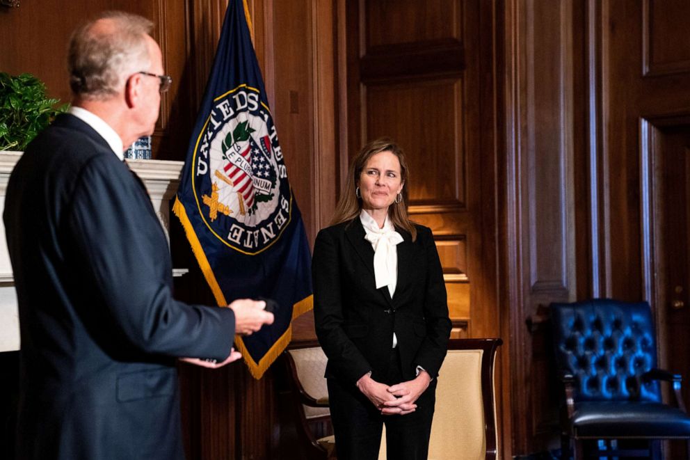 PHOTO: Judge Amy Coney Barrett, President Donald Trump's nominee for Supreme Court, and Sen. Jerry Moran pose for a photo before a meeting at the United States Capitol Building in Washington, Oct. 1, 2020.