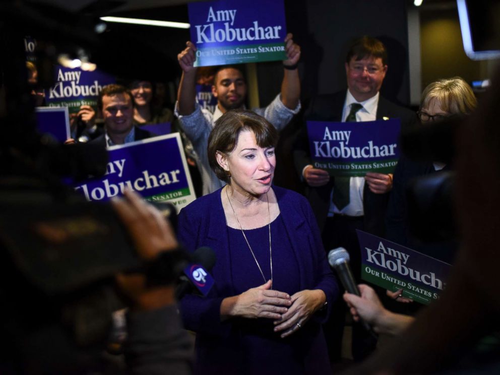 PHOTO: Sen. Amy Klobuchar speaks to the media after she arrives at the Intercontinental Hotel for DFL headquarters election night party Tuesday, Nov. 6, 2018, in St. Paul, Minn.