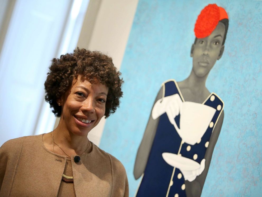 PHOTO: The Outwin Boochever Portrait Competition 2016 first prize winner, Amy Sherald, in front of her work, March 11, 2016, at the Smithsonians National Portrait Gallery in Washington.