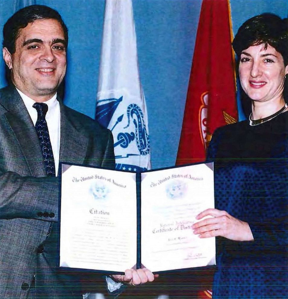PHOTO: FILE - An undated handout image from a U.S. Department of Defense report dating back to 2005 shows Ana Belen Montes receiving a national intelligence certificate of distinction from George Tenet.