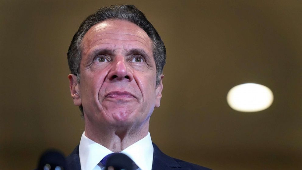 PHOTO: New York Governor Andrew Cuomo listens to speakers in Mt. Vernon, N.Y., March 22, 2021.