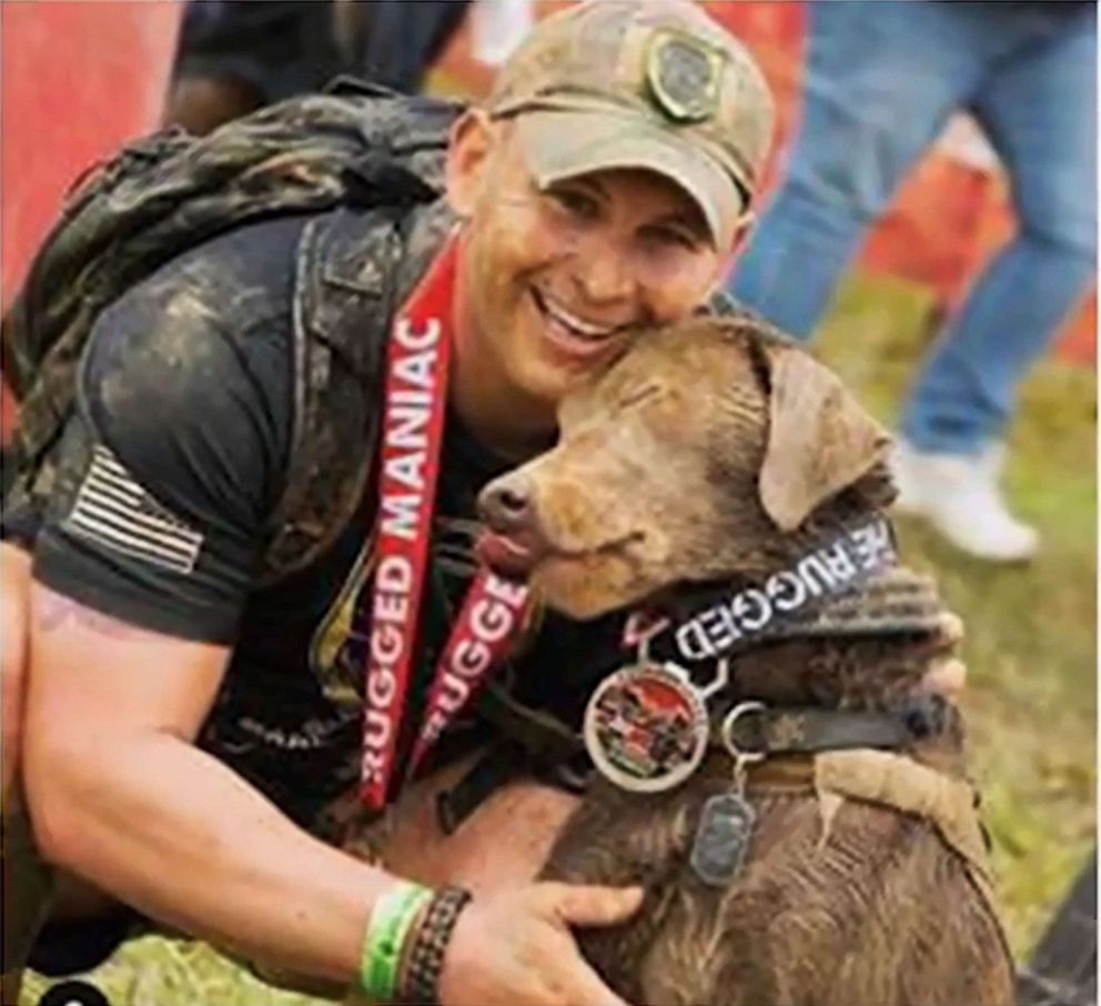 PHOTO: Officer Andrew Einstein is pictured with his service dog.