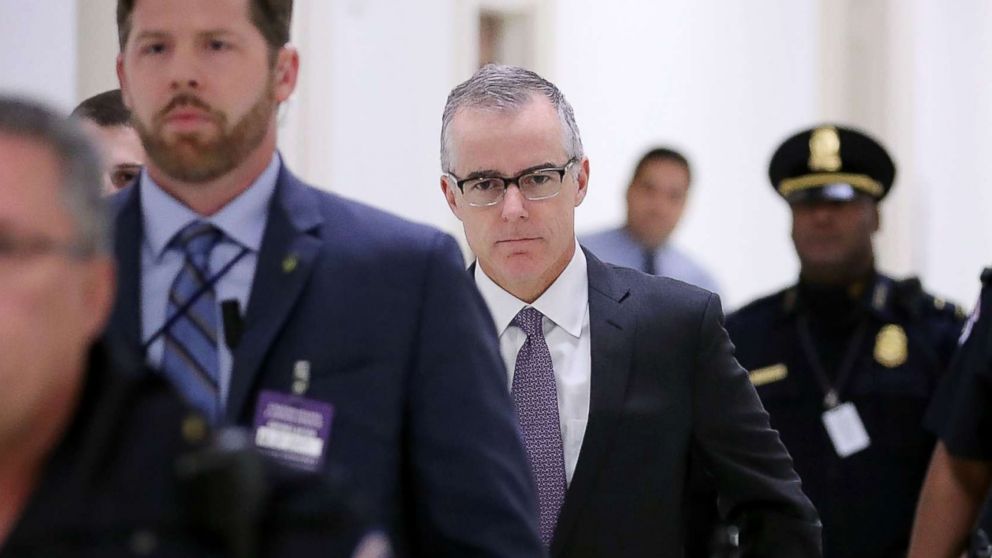 FBI Deputy Director Andrew McCabe is escorted by U.S. Capitol Police before a meeting with members of the Oversight and Government Reform and Judiciary committees in Washington, Dec. 21, 2017.