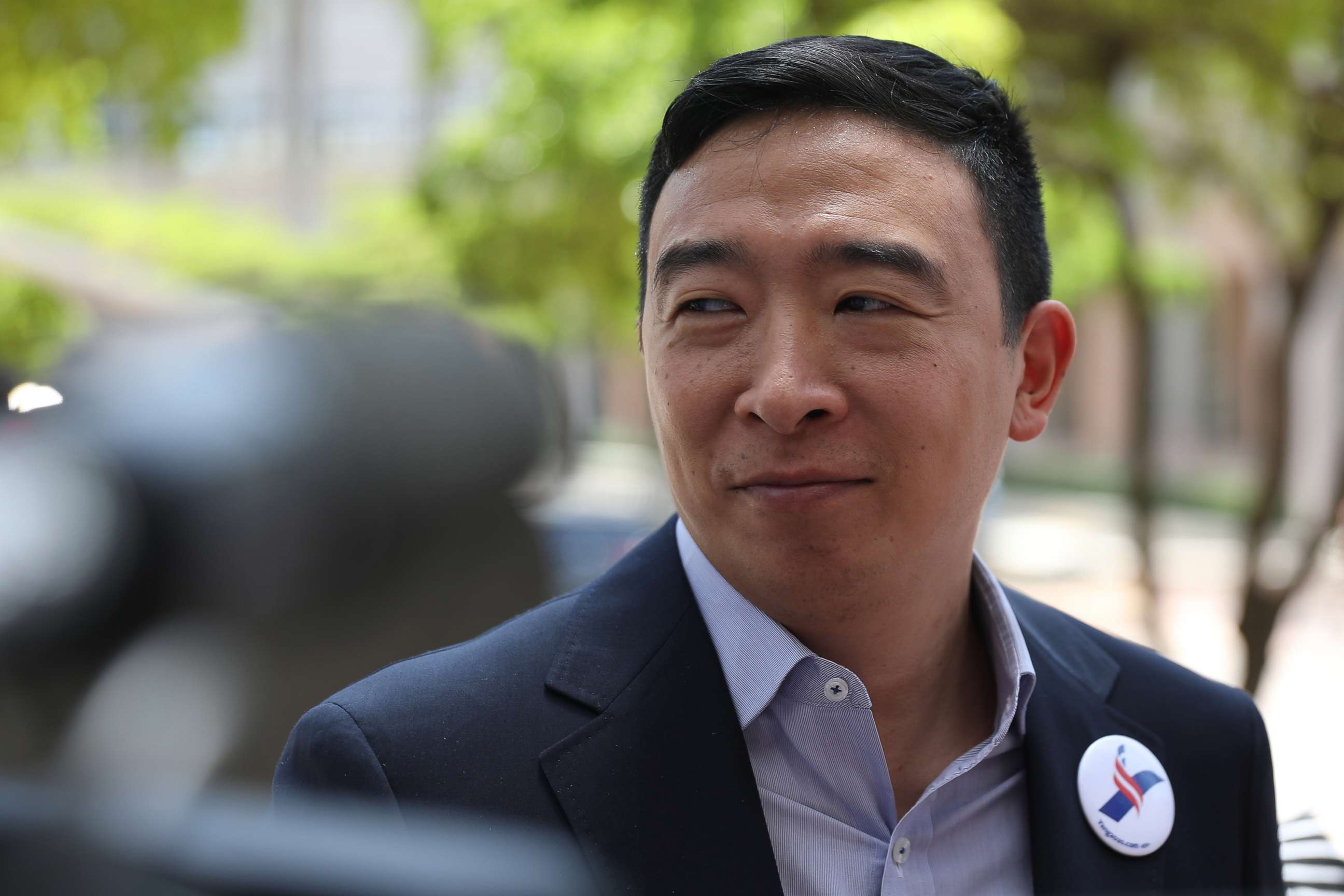 PHOTO: Democratic presidential candidate Andrew Yang speaks to media outside the Knight Concert Hall of the Adrienne Arsht Center for the Performing Arts of Miami-Dade County June 26, 2019, in Miami.