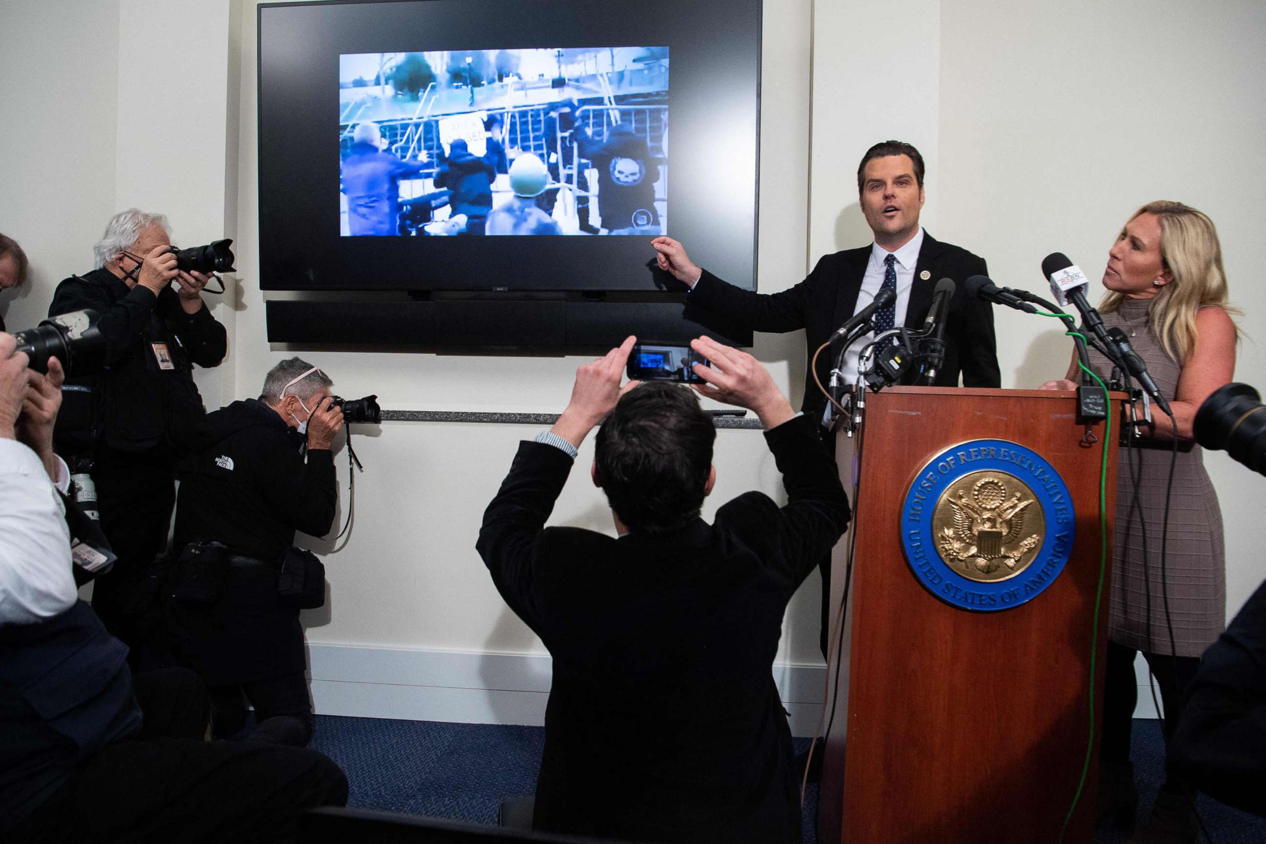 PHOTO: Representatives Marjorie Taylor Greene and Representative Matt Gaetz show video from the January 6, 2021 attack on the US Capitol as they speak about what they say happened that day, during a press conference in Washington, DC, Jan. 6, 2022.