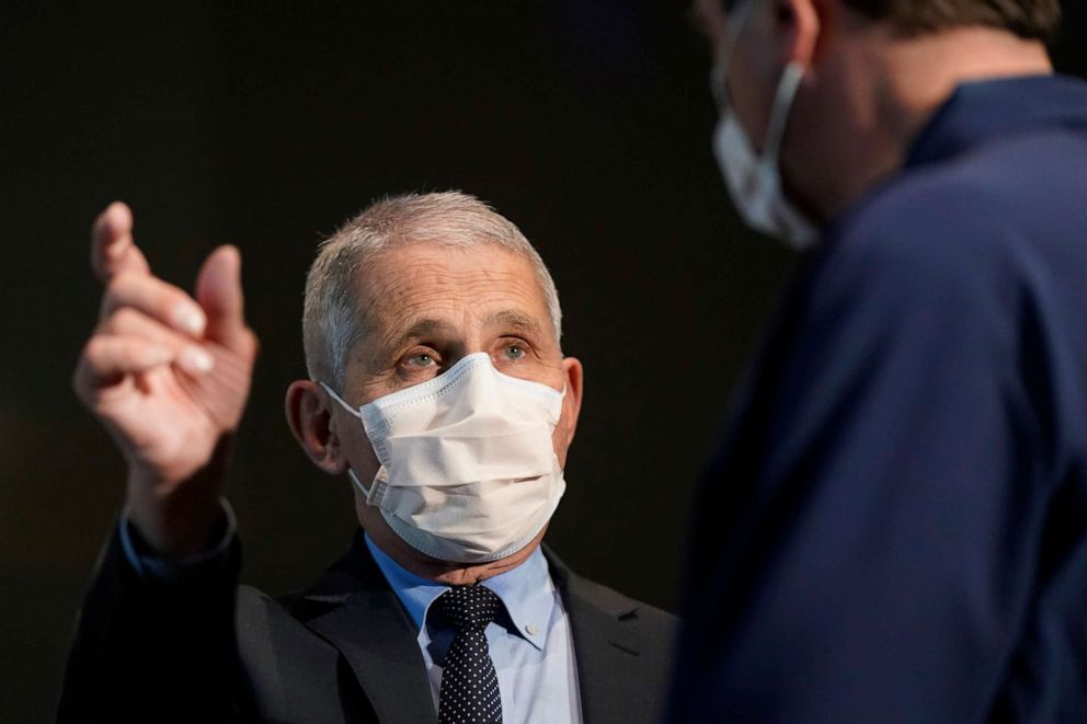 PHOTO: Dr. Anthony Fauci speaks with Health and Human Services Secretary Alex Azar before receiving his first dose of the COVID-19 vaccine at the National Institutes of Health on Dec. 22, 2020, in Bethesda, Md.