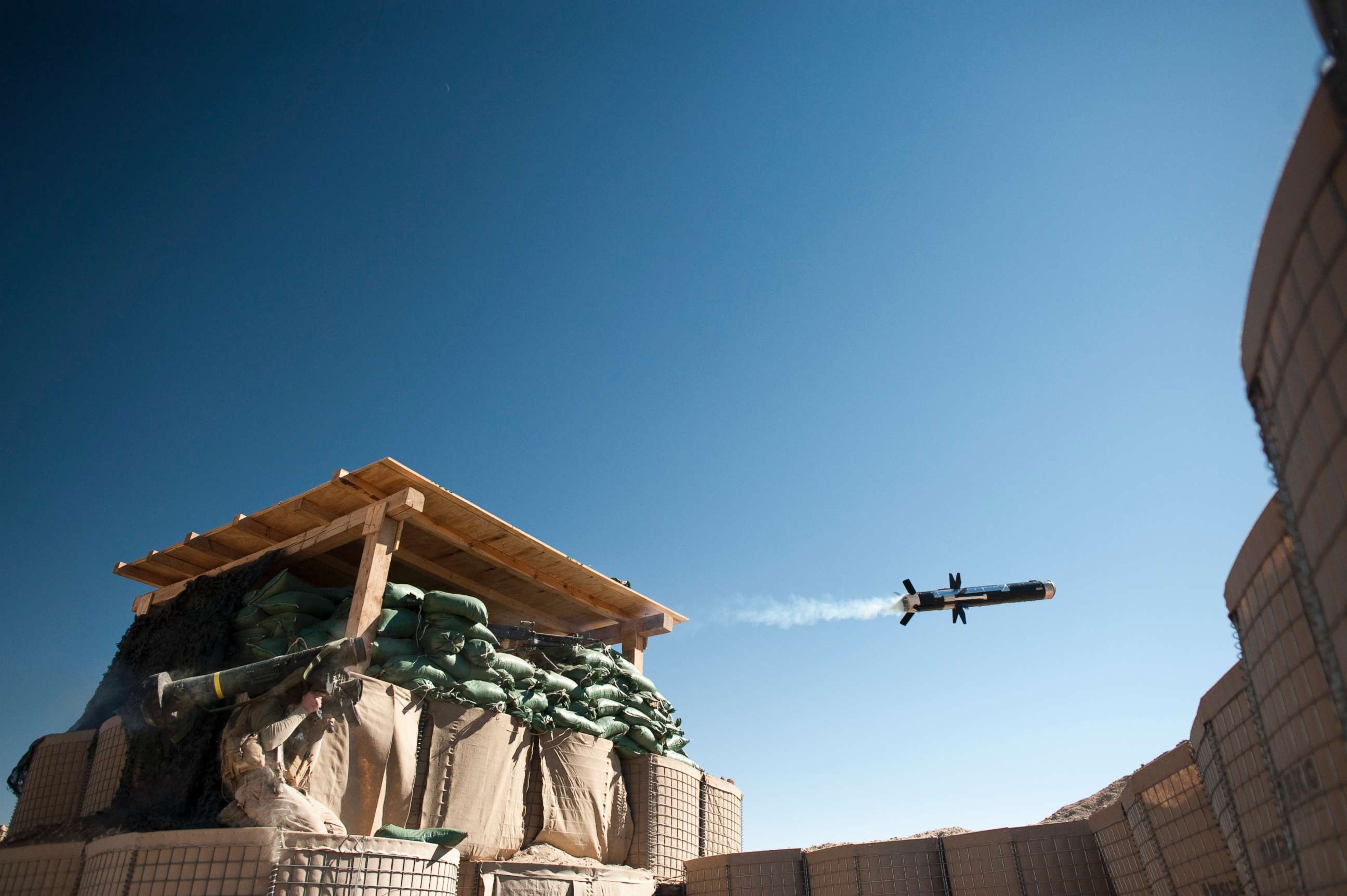 PHOTO: A US Marine from 1st Battalion, 8th Marines, Bravo company launches an FMG-148 Javelin anti-tank missile at Mirage patrol base, Musa Qala District, Helmand province on February 8, 2011. 