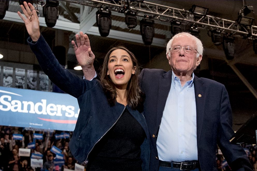 PHOTO: In this Feb. 10, 2020 file photo, Democratic presidential candidate Sen. Bernie Sanders, I-Vt., right, and Rep. Alexandria Ocasio-Cortez, D-N.Y. wave to supporters at campaign stop at the University of New Hampshire in Durham, N.H.
