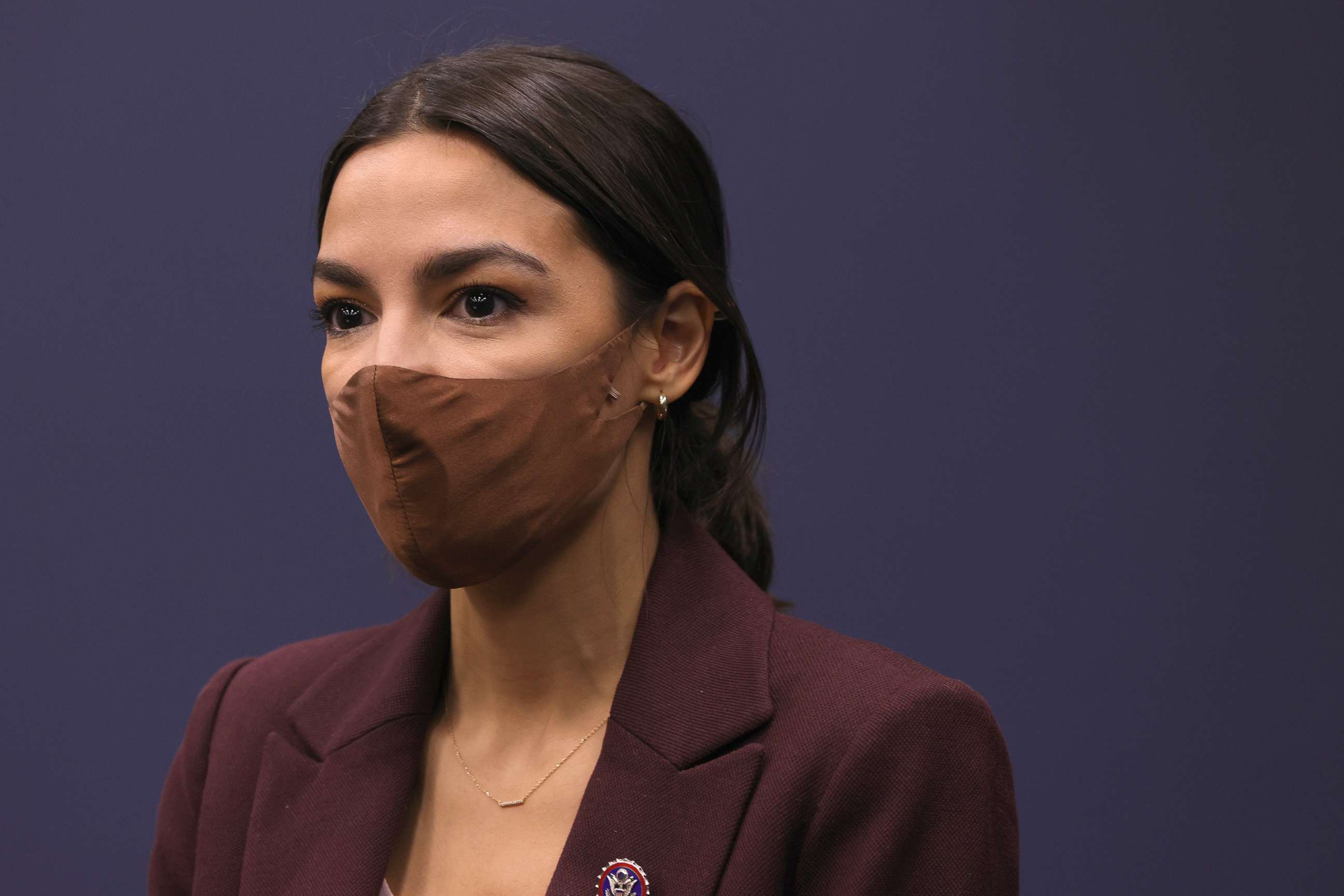 PHOTO: Rep. Alexandria Ocasio-Cortez listens during a news conference to introduce the "Puerto Rico Self-Determination Act of 2021" at Rayburn House Office Building on Capitol Hill, March 18, 2021.