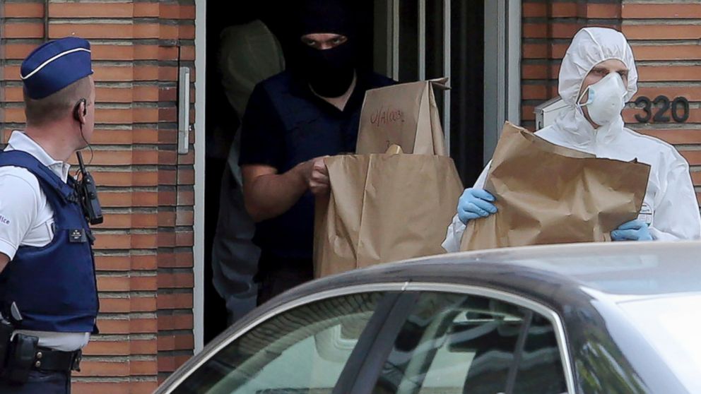 Police and forensic officers work during a house search in the Molenbeek district of Brussels, June 21, 2017, the day after a man detonated an explosive at a train station. 