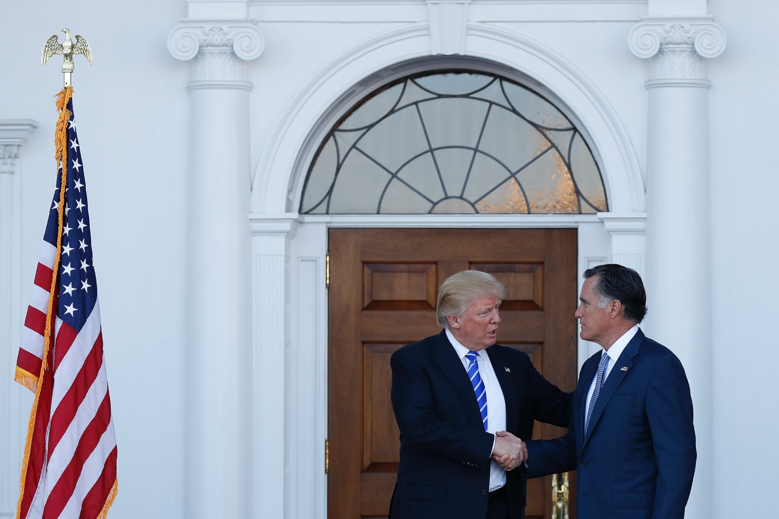 PHOTO: President-elect Donald Trump and Mitt Romney shake hands as Romney leaves Trump National Golf Club Bedminster in Bedminster, N.J., Nov. 19, 2016.
