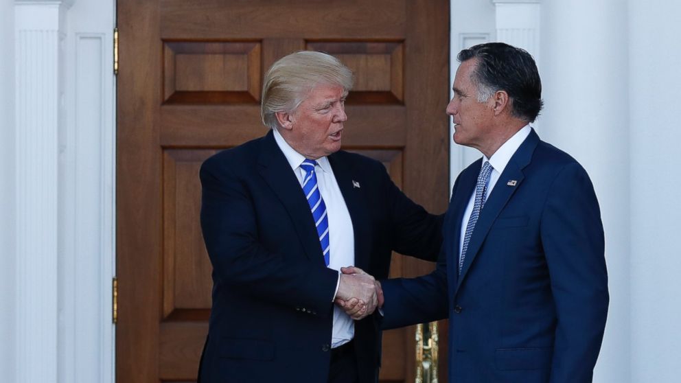 President-elect Donald Trump and Mitt Romney shake hands as Romney leaves Trump National Golf Club Bedminster in Bedminster, N.J., Nov. 19, 2016.