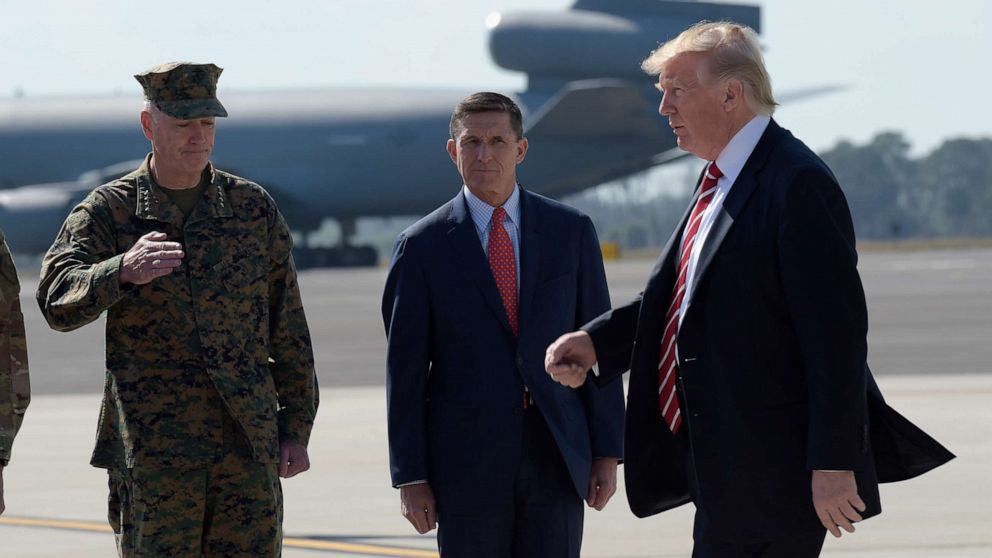 PHOTO: President Donald Trump passed Joint Chiefs Chairman Gen. Joseph Dunford, left, and National Security Adviser Michael Flynn as he arrives via Air Force One at MacDill Air Force Base in Tampa, Florida, Feb. 6, 2017. 