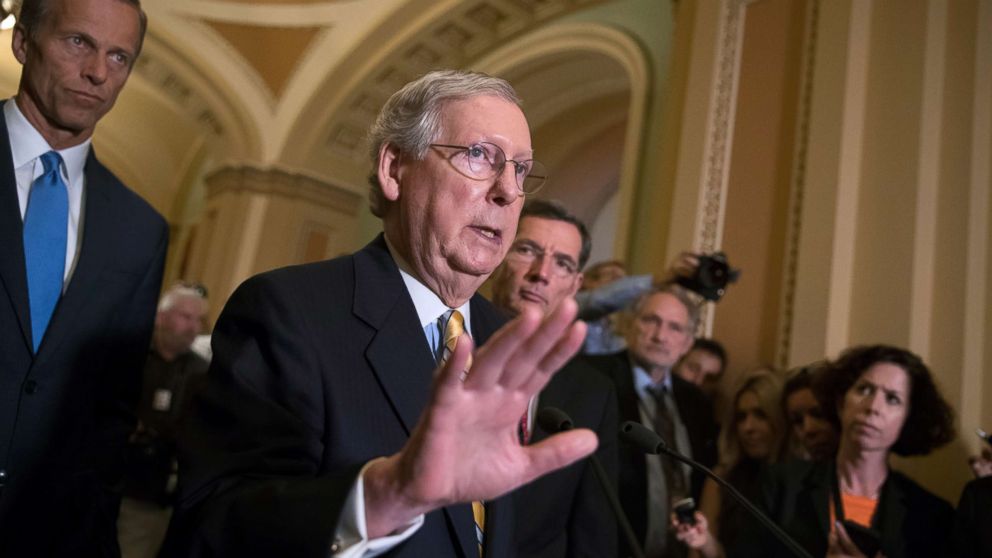 Senate Majority Leader Mitch McConnell tells reporters he is delaying a vote on the Republican health care bill while GOP leadership works toward getting enough votes, at the Capitol in Washington, June 27, 2017.