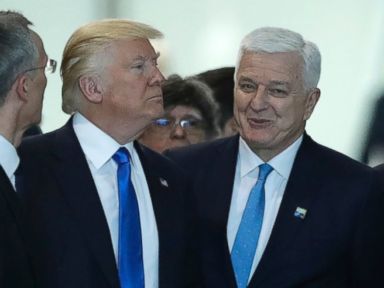 PHOTO: Montenegro Prime Minister Dusko Markovic, center right, smiles after appearing to be pushed by President Donald Trump during a NATO summit of heads of state and government in Brussels on May 25, 2017.