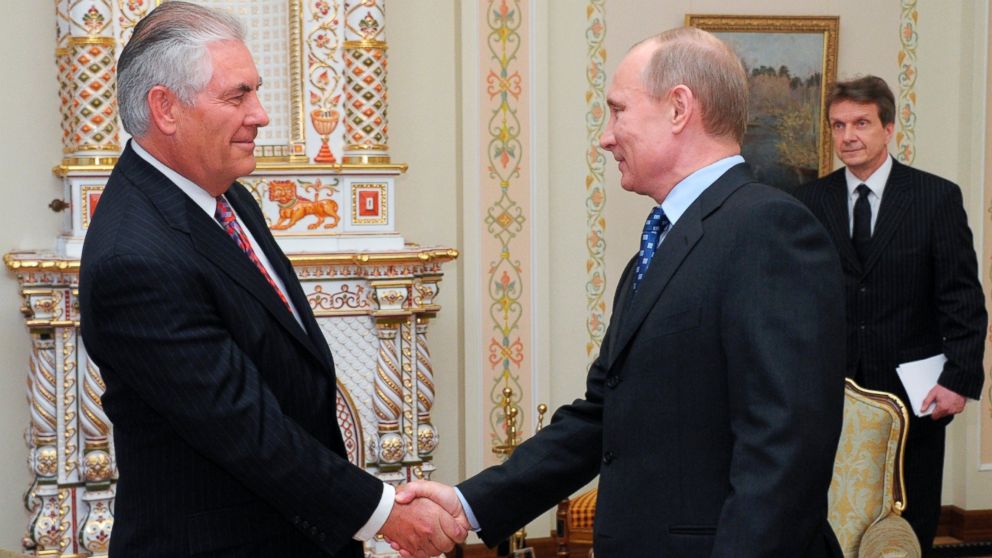 PHOTO: Russian Prime Minister Vladimir Putin shakes hands with Rex Tillerson of Exxon Mobil Corporation at their meeting in the Novo-Ogaryovo residence outside Moscow, Monday, April 16, 2012.