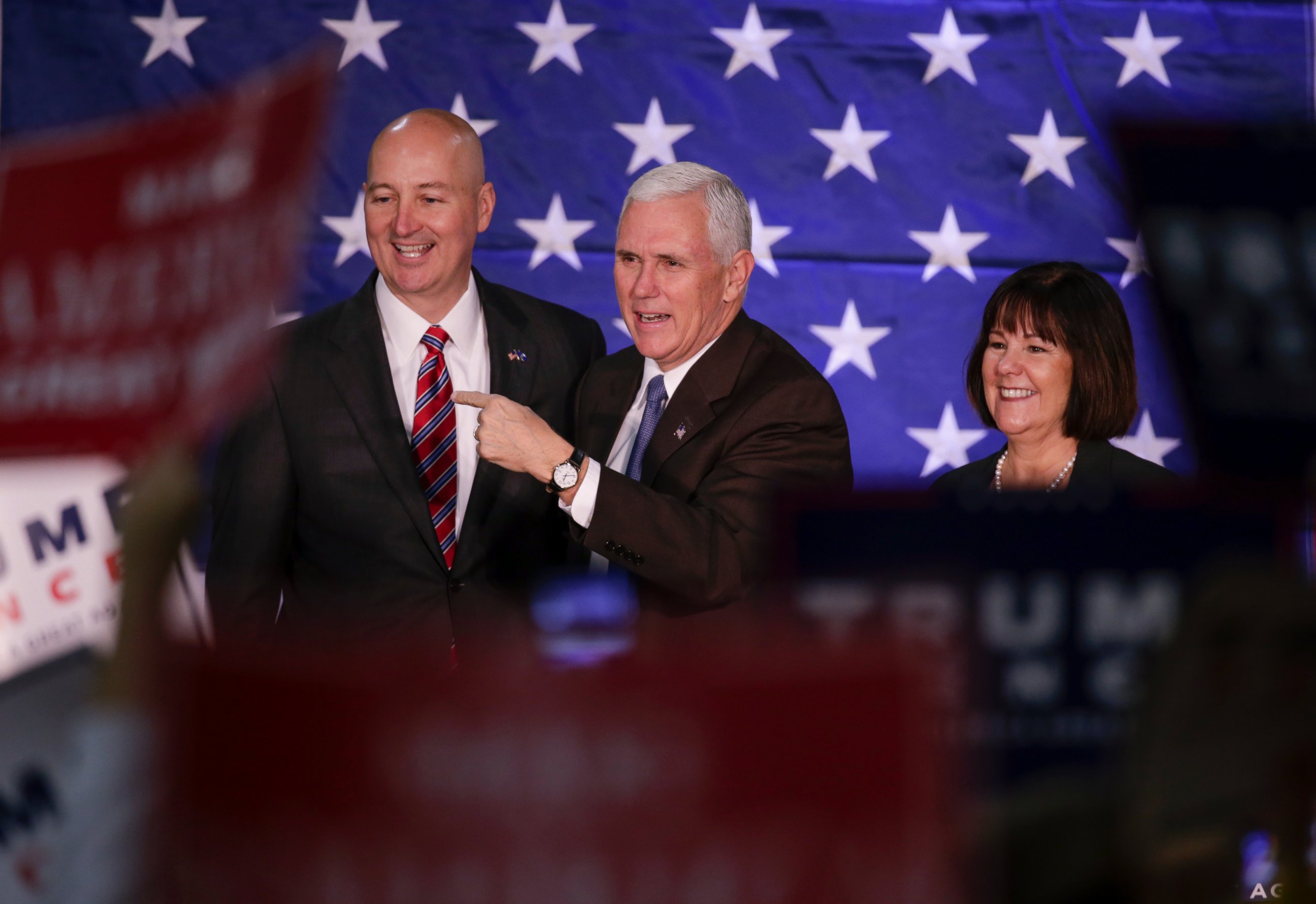 PHOTO: Mike Pence, and his wife Karen, stand on stage with Nebraska Governor Pete Ricketts before speaking at a campaign stop in Omaha, Oct. 27, 2016. 