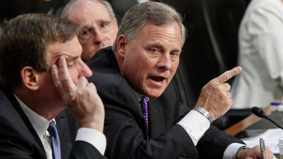 Senate Intelligence Committee Chairman Richard Burr, joined at left by Vice Chairman Mark Warner and Sen. Jim Risch, orders Sen. Kamala Harris to suspend her inquiry of top national security chiefs testifying on the gathering intelligence on foreign agents, on Capitol Hill in Washington, June 7, 2017. 