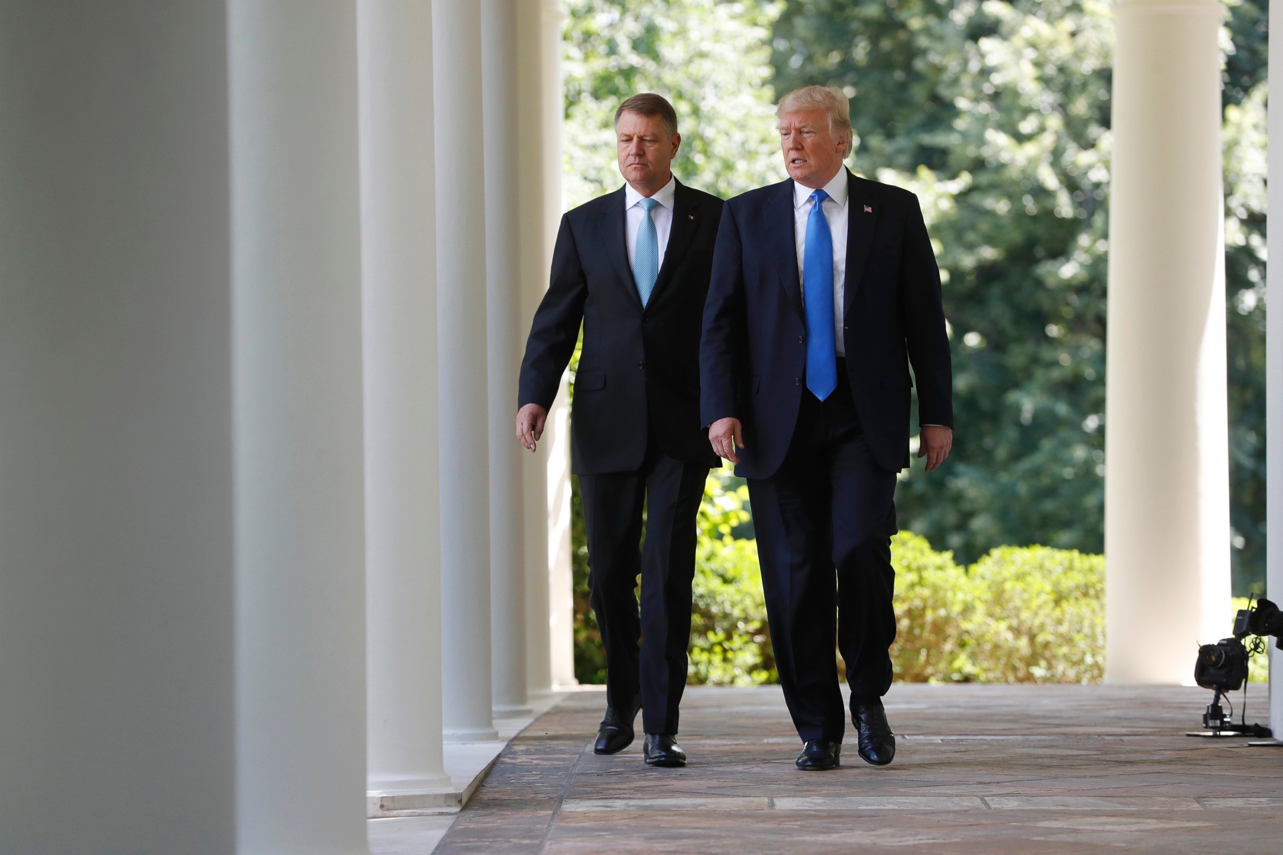PHOTO: President Donald Trump and Romanian President Klaus Werner Iohannis walk to the Rose Garden for their joint news conference at the White House, June 9, 2017. 